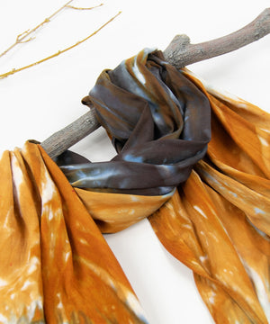 
                
                    Load image into Gallery viewer, Orange and black tie dye scarf by Akasha Sun.
                
            