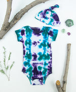 Teal + Purple tie dye baby bodysuit + hat set made of organic cotton.