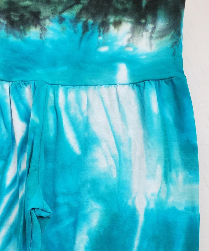 
                
                    Load image into Gallery viewer, Teal tie dye yoga leggings with a wide waistband.
                
            