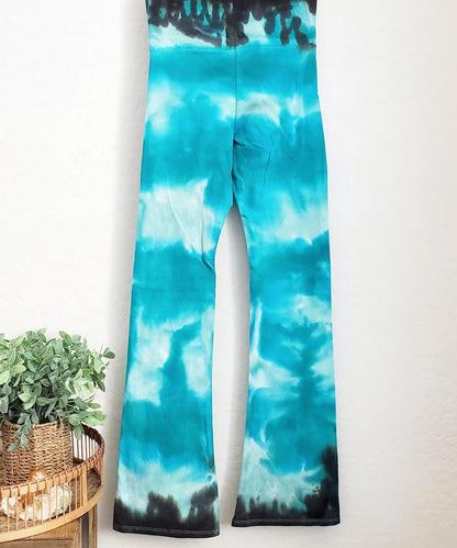 Teal tie dye yoga pants with a wide waistband.