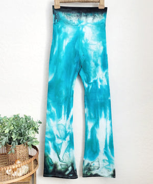 Teal tie dye yoga pants with a wide waistband.