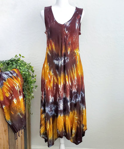 An amber and black tie dye short sleeve waterfall dress with a v-neck.