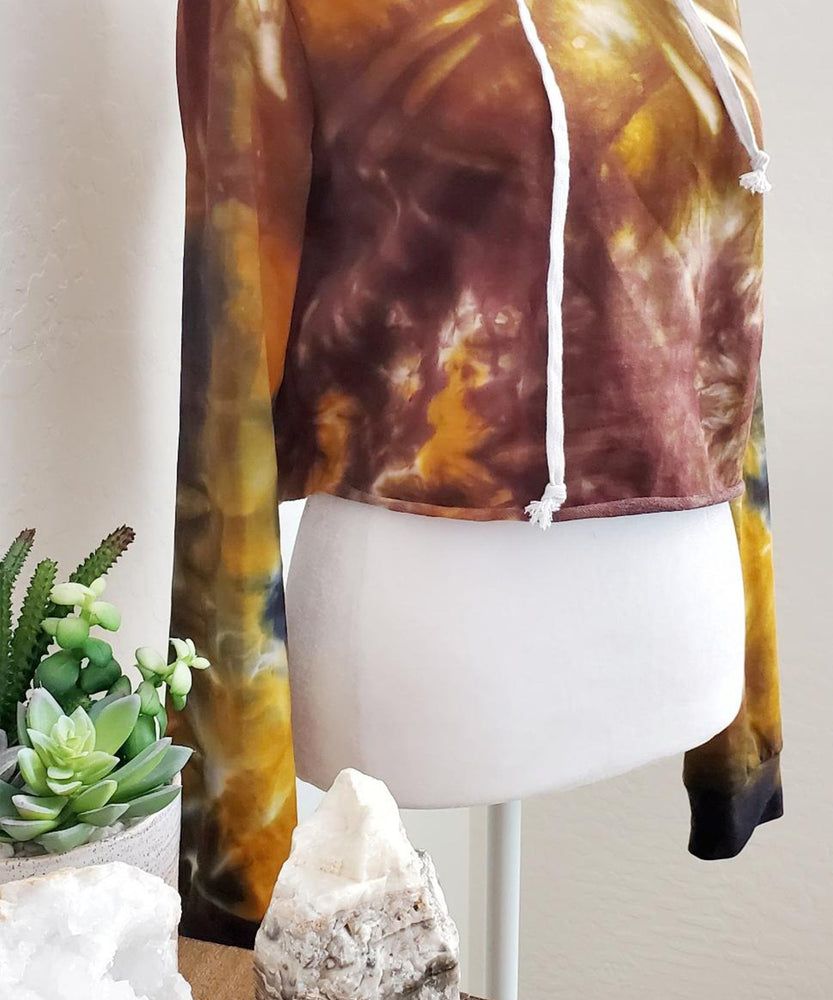 Amber tie dye hoodie crop top with drawstrings and hood.
