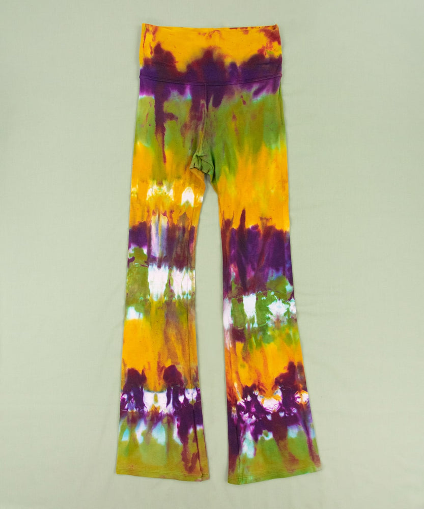 Green, purple, and yellow tie dye yoga pants with a wide waistband by Akasha Sun.