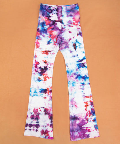 Ice dyed yoga pants in the colors purple, red, and blue.