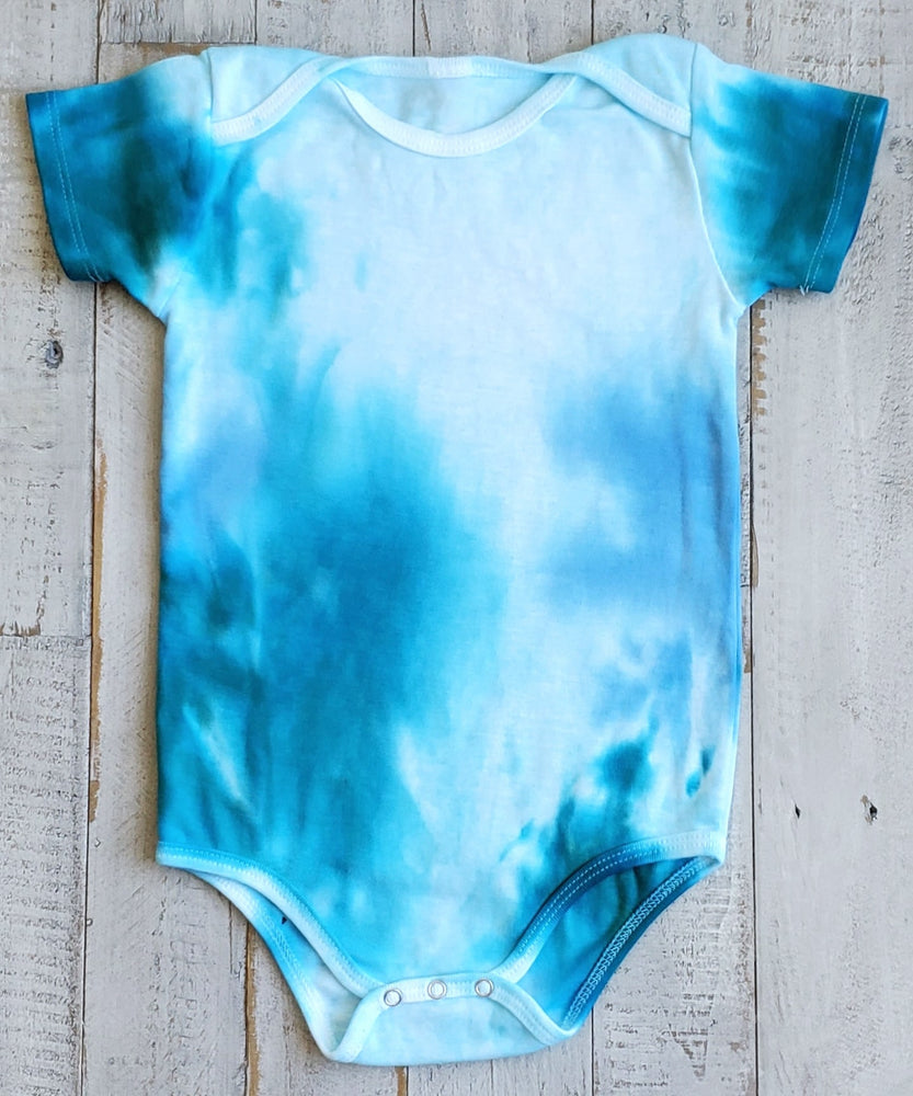 
                
                    Load image into Gallery viewer, An aqua blue tie dye baby bodysuit, blanket, and hat set.
                
            