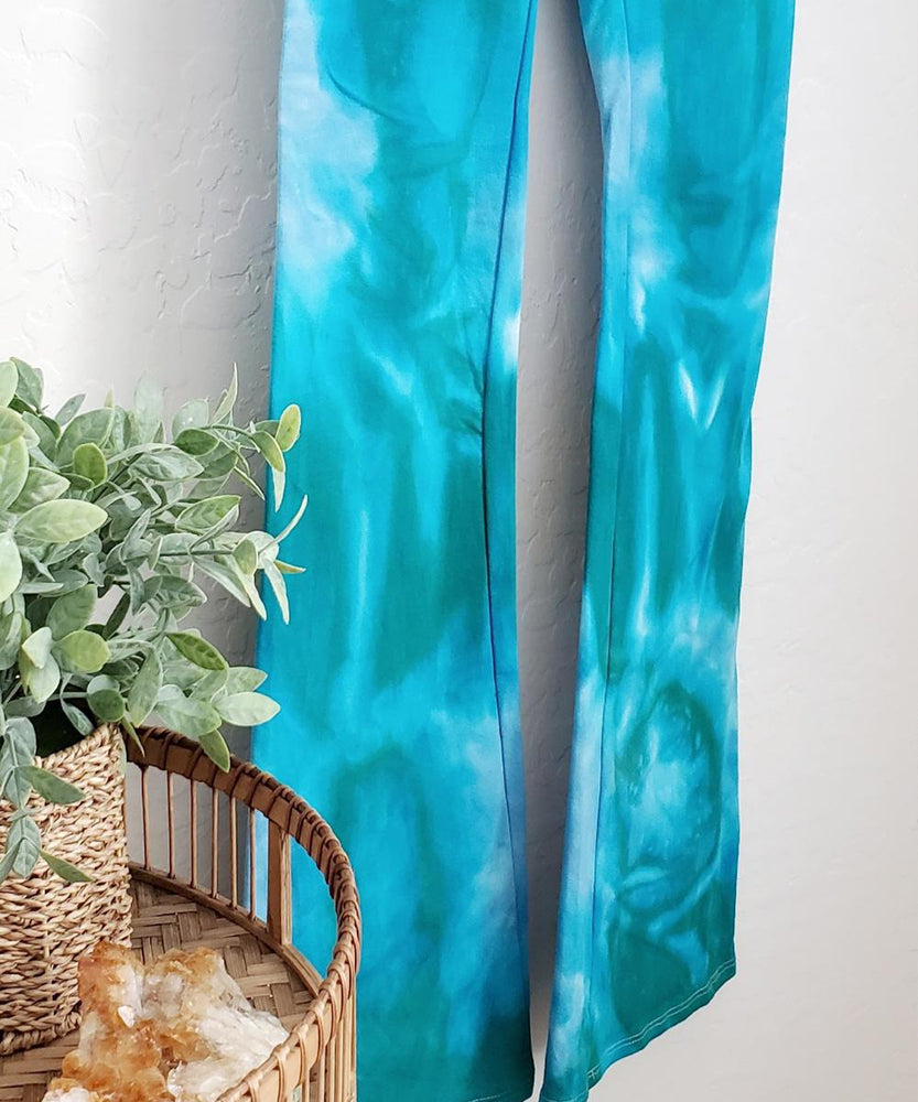 
                
                    Load image into Gallery viewer, Teal tie dye yoga pants with wide waistband.
                
            