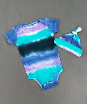 
                
                    Load image into Gallery viewer, Blue, teal, and black baby bodysuit and hat.
                
            