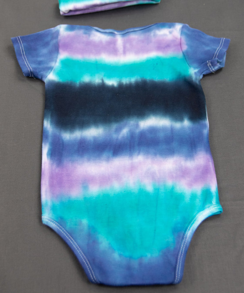 
                
                    Load image into Gallery viewer, Blue, teal, and black baby bodysuit and hat.
                
            