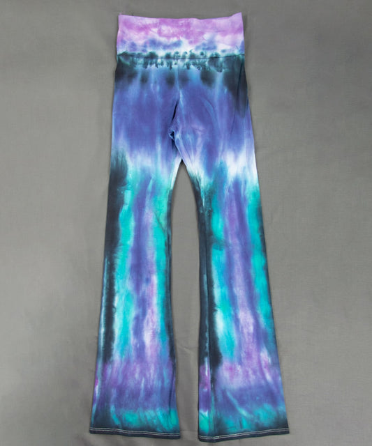 Teal, purple, and black tie dye yoga pants with flare bottoms and wide waistband.