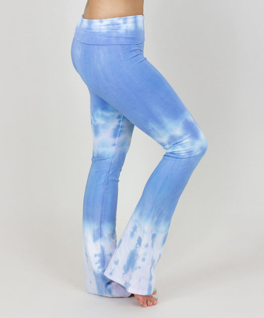 Woman wearing a pair of blue and white fold over yoga pants made of sustainable cotton.