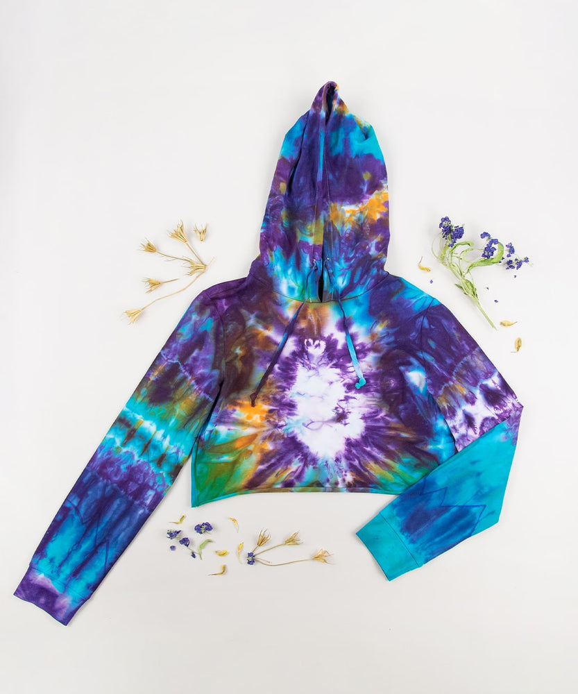 Purple, blue, and orange tie dye crop top hoodie by Akasha Sun.