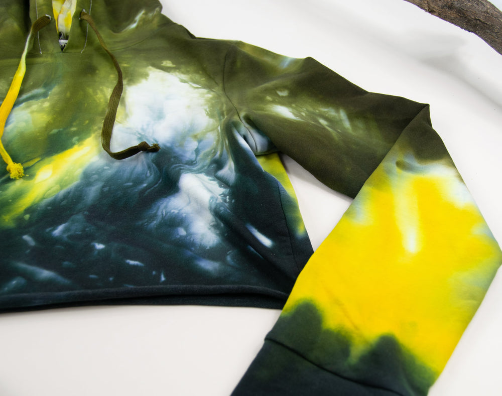
                
                    Load image into Gallery viewer, Yellow + black tie dye hoodie crop top with long sleeves and a hood by Akasha Sun.
                
            