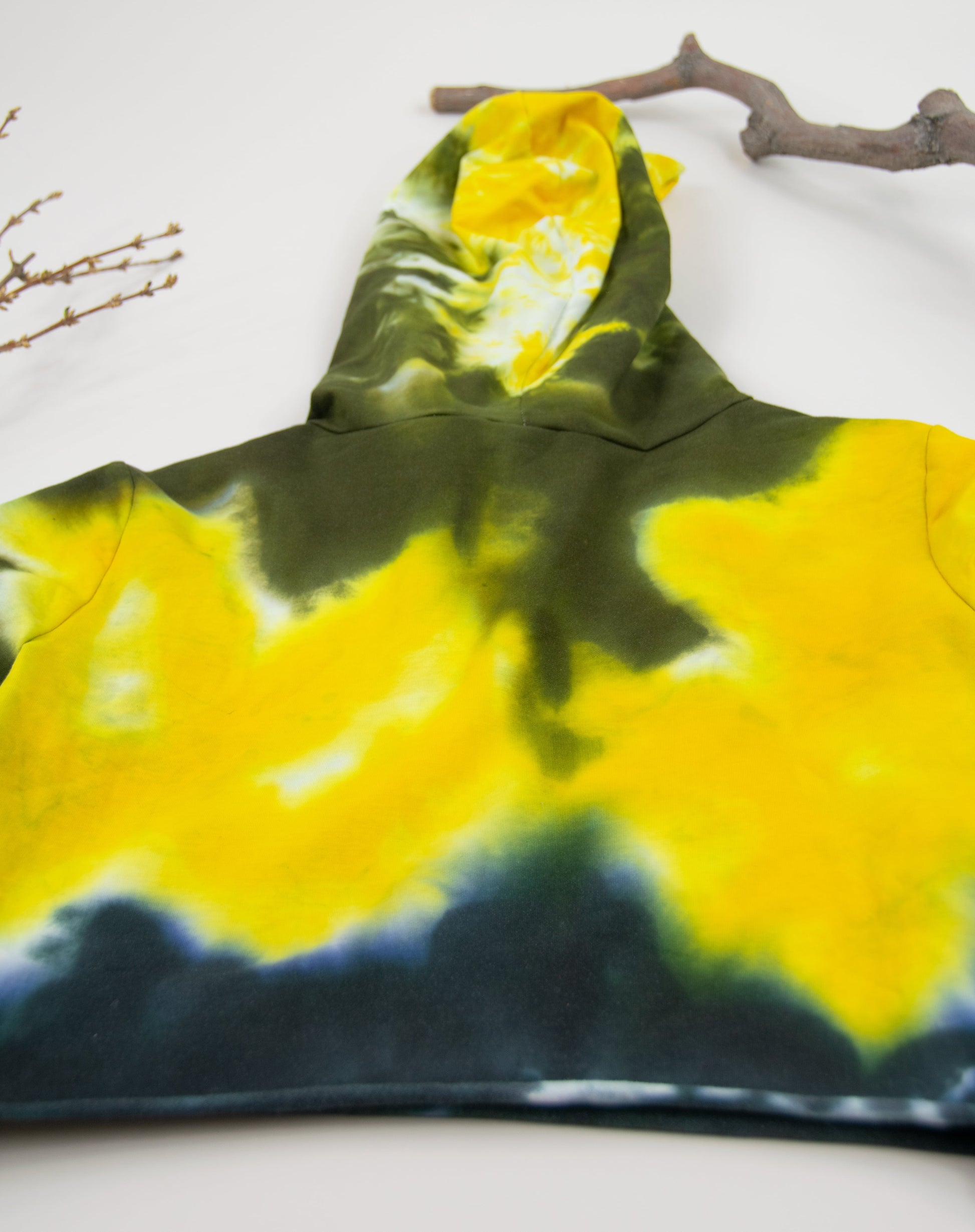 Yellow + black tie dye hoodie crop top with long sleeves and a hood by Akasha Sun.