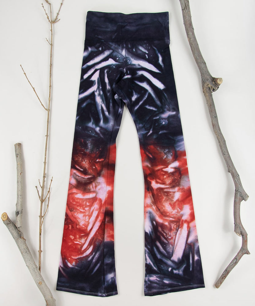 Black + red tie dye yoga pants with a fold over waistband by Akasha Sun.