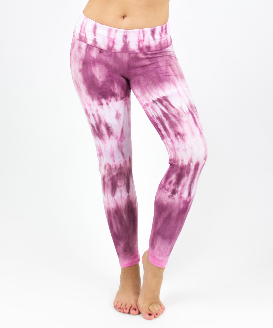 Woman wearing a pair of pink tie dye fold over leggings by Akasha Sun.