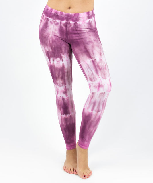 Woman wearing a pair of pink tie dye leggings by Akasha Sun.