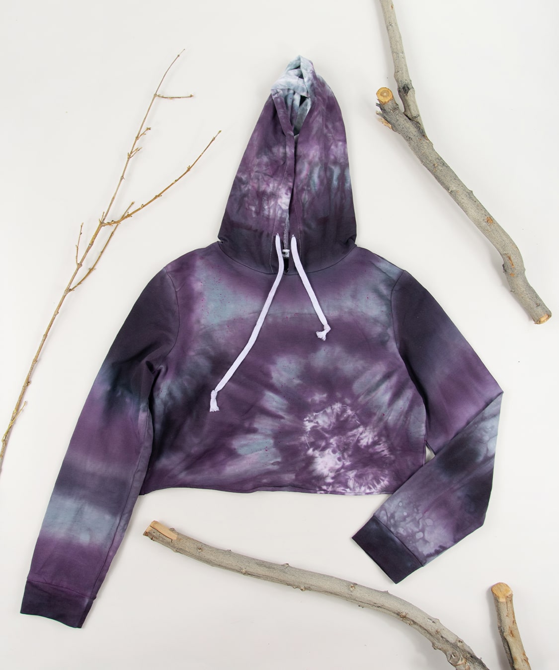 Purple, gray, and black tie dye hoodie crop top.