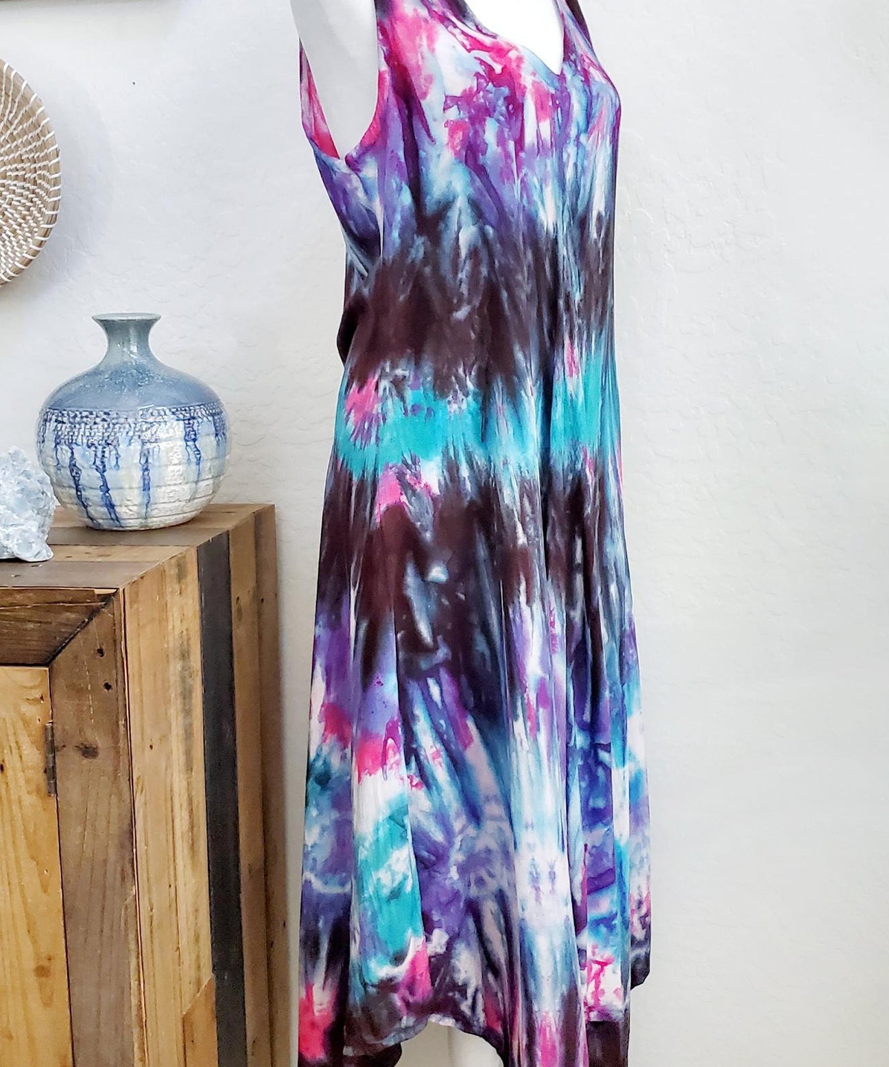 A teal, black, and purple tie dye dress.