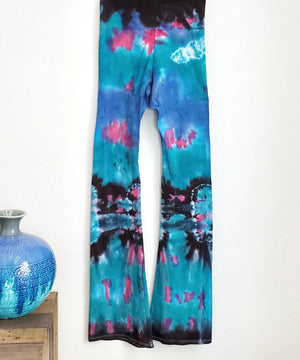 Teal, black, and blue tie dye yoga pants with a fold over waistband.