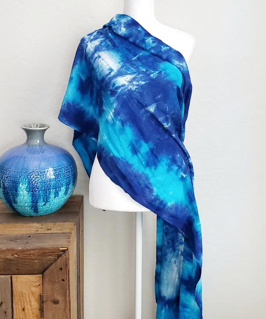 Blue tie dye scarf with fringe.