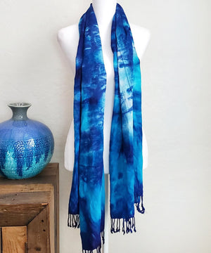 Blue tie dye scarf with fringe.