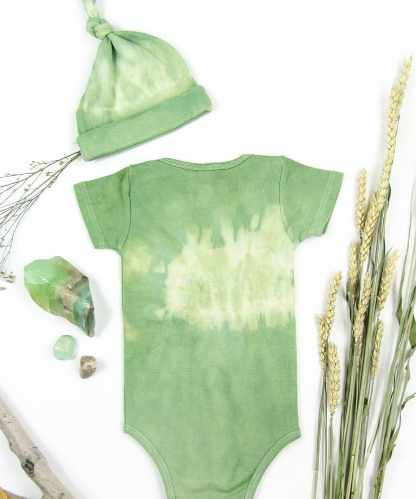 Green tie dye onesie and baby hat set made with organic cotton.