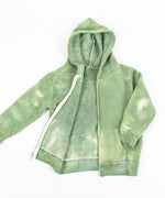 The Green Earth tie dye jacket that features a soft fleece interior, a hood, and a zipper.  The colors are a soft olive and sage green.