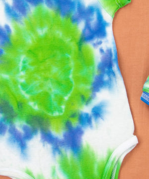 
                
                    Load image into Gallery viewer, Blue, green, and white tie dye organic baby set that includes a baby blanket, bodysuit, and baby hat.
                
            