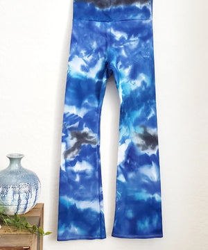Blue and white tie dye yoga pants with a wide waistband.