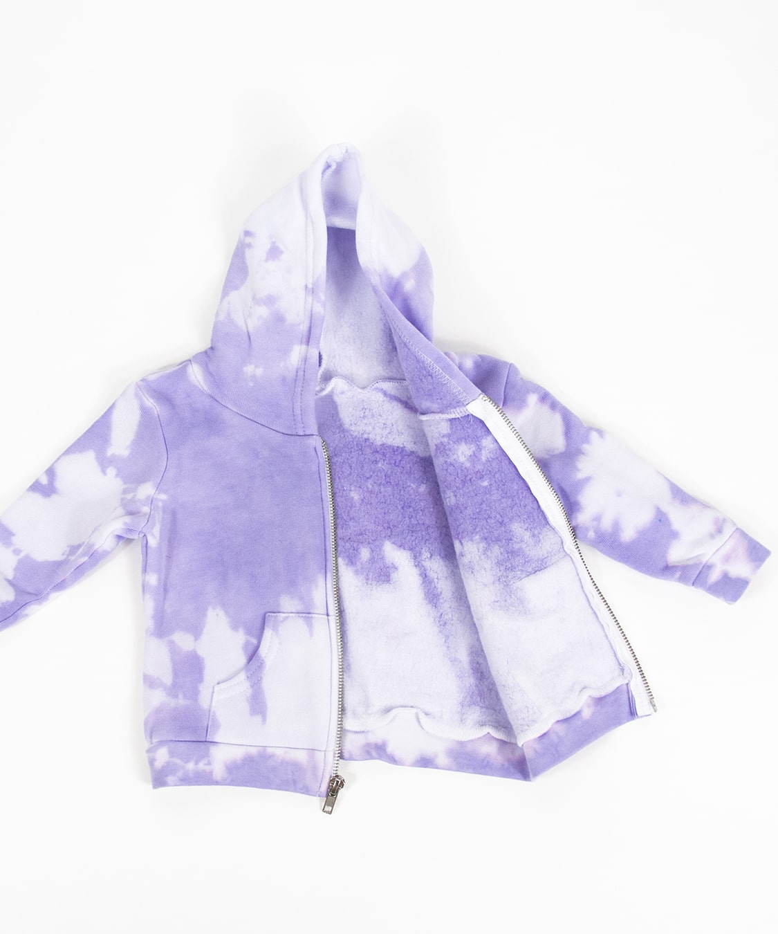 Purple and white tie dye baby set that includes an organic onesie, organic baby hat, and jacket.