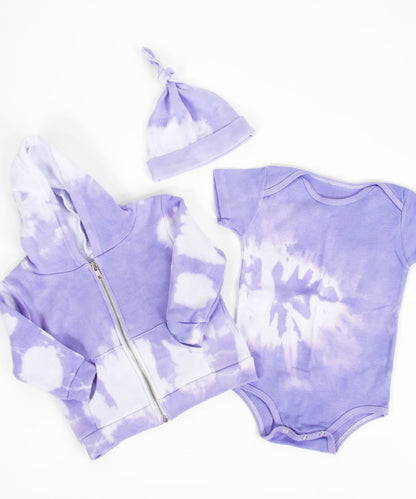 Purple and white tie dye baby set that includes an organic onesie, organic baby hat, and jacket.