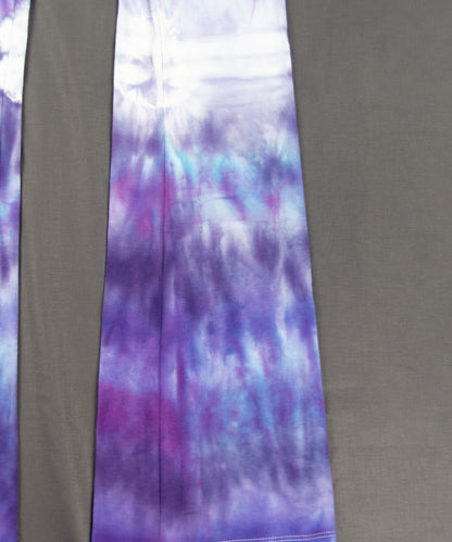 Lavender tie dye yoga pants with a wide waistband and flare bottoms.