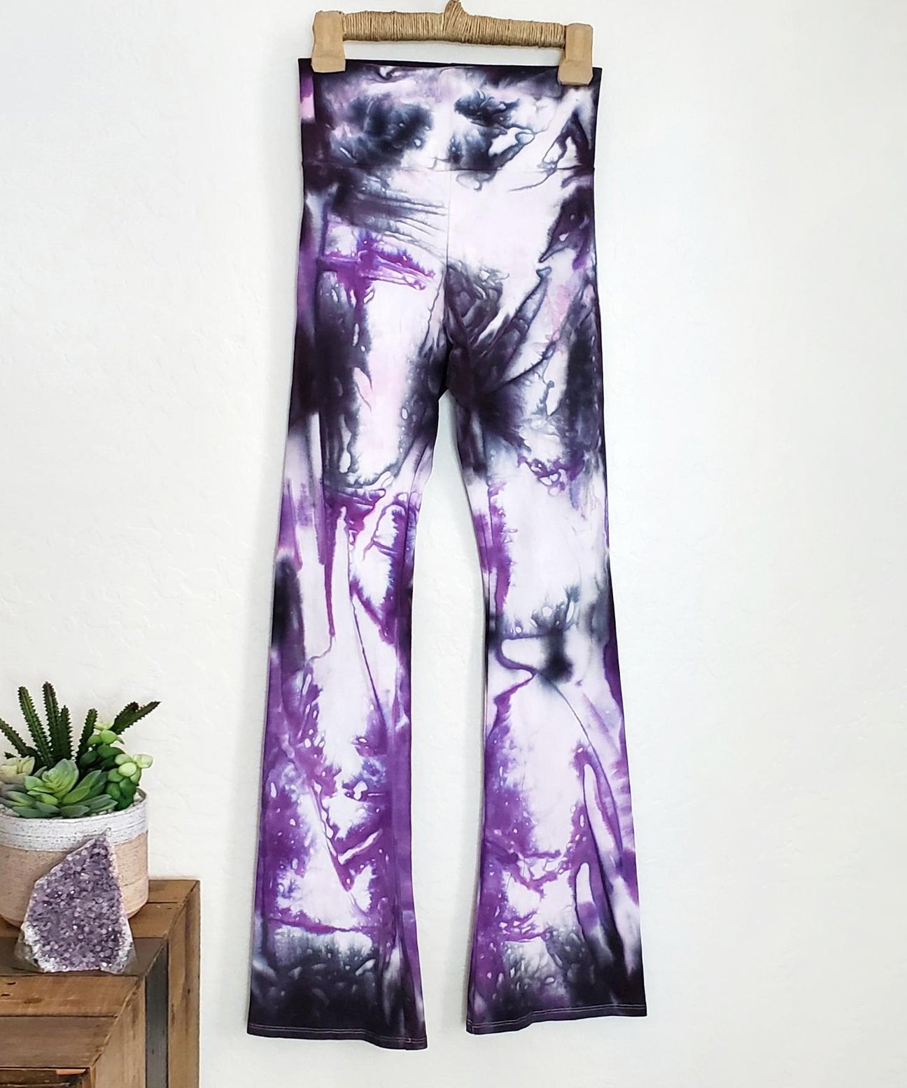 Purple and black tie dye yoga pants with wide waistband.