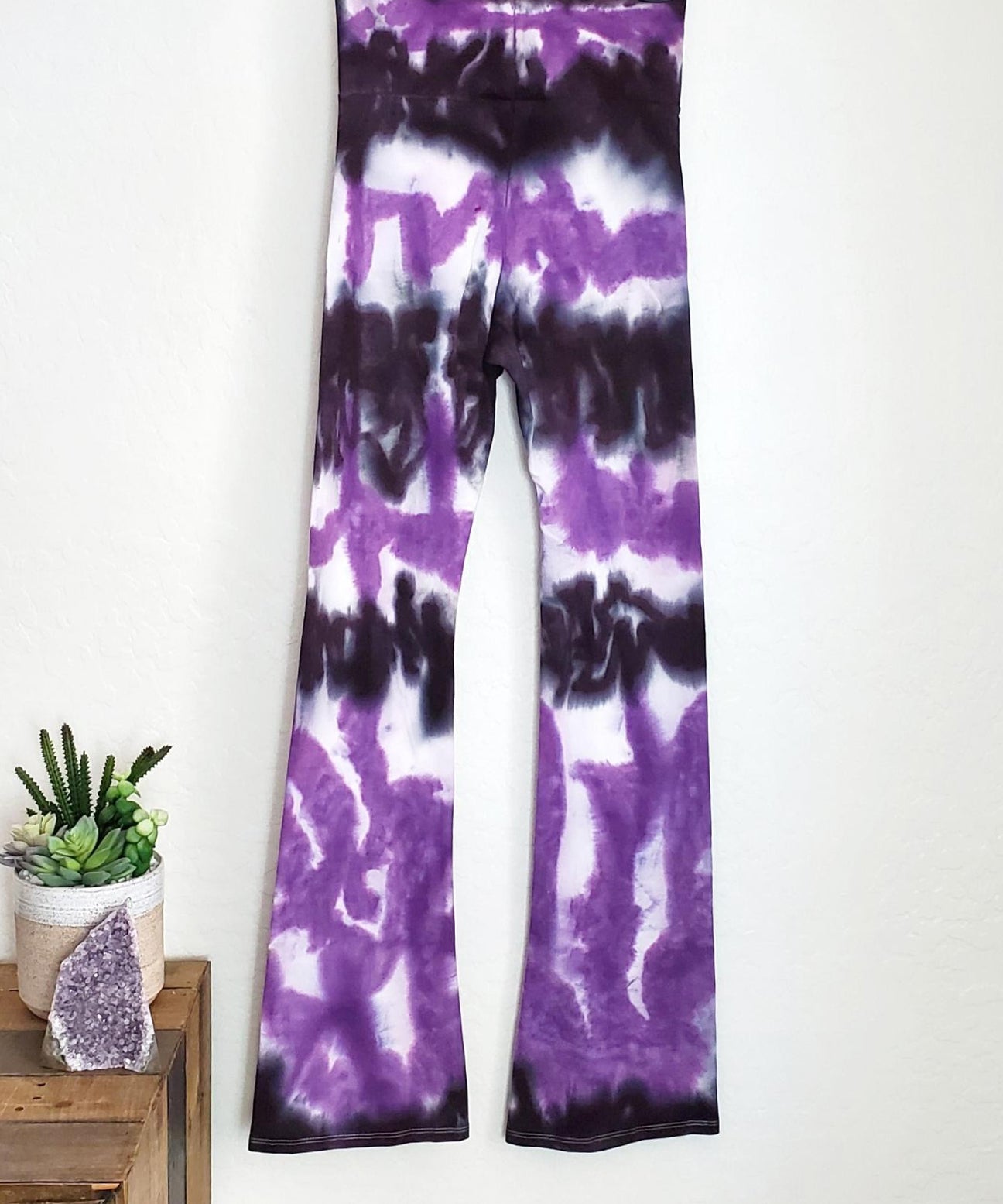 Purple and black tie dye yoga pants with wide waistband.