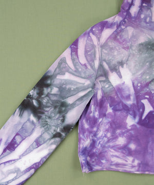 
                
                    Load image into Gallery viewer, Purple and black tie dye hoodie crop top with draw strings.
                
            