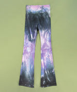 Black and purple tie dye yoga pants with a wide waistband and flare bottoms.