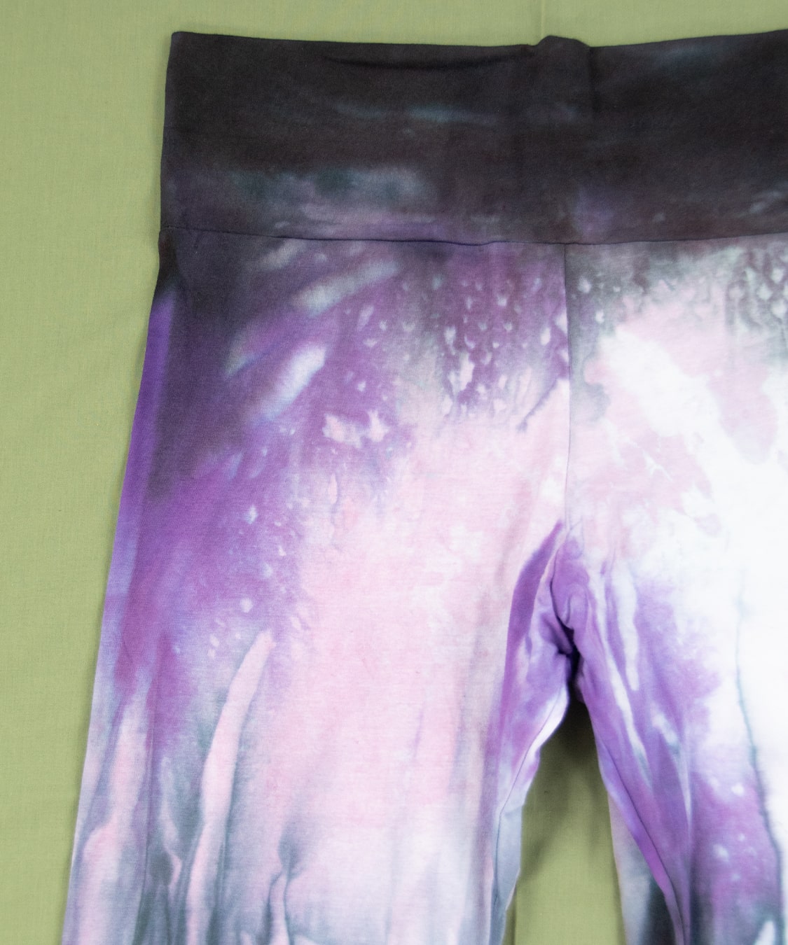 Purple and black tie dye yoga pants with wide waistband and flare bottoms by Akasha Sun.