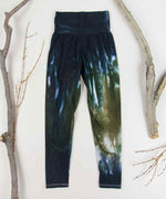 Black and green tie dye yoga leggings with a wide waistband by Akasha Sun.