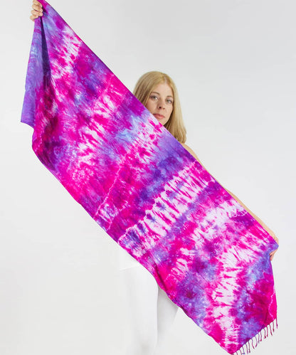 Woman wearing a pink and purple tie dye scarf by Akasha Sun.