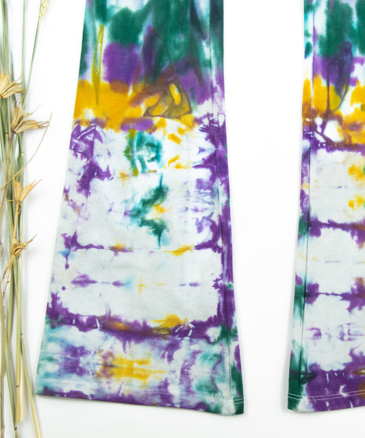 Tie dye Mardi Gras yoga pants with a foldover waistband by Akasha Sun.