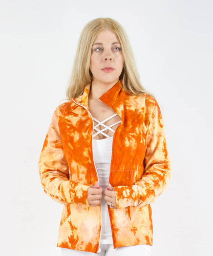 Woman wearing an orange tie dye jacket in a cadet style with zipper and pockets.