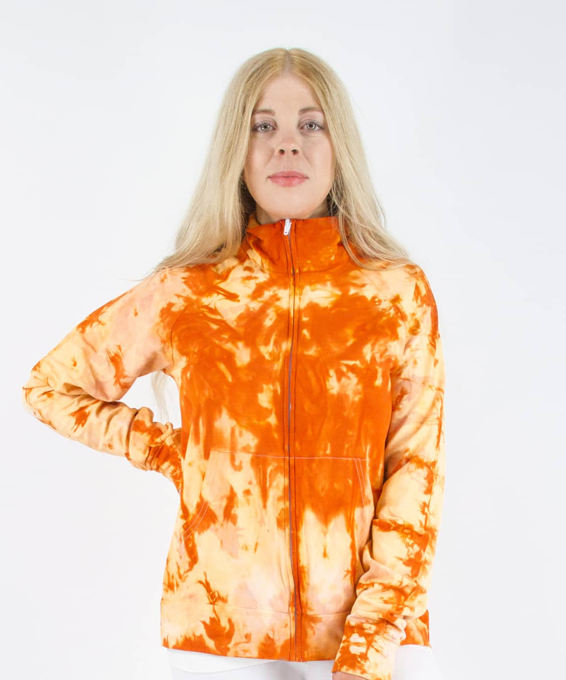 Woman wearing an orange tie dye jacket in a cadet style with zipper and pockets.