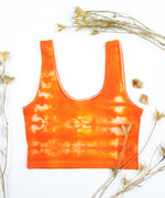 Orange tie dye crop top by Akasha Sun.