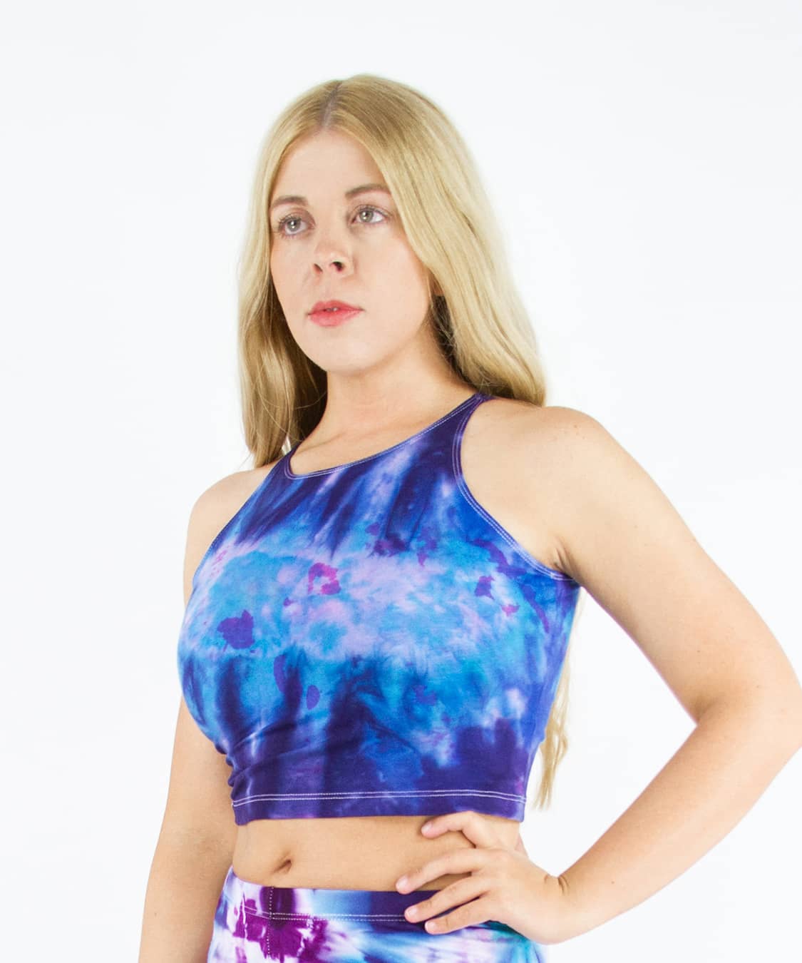 Woman wearing an Akasha Sun blue and purple tie dye crop top.