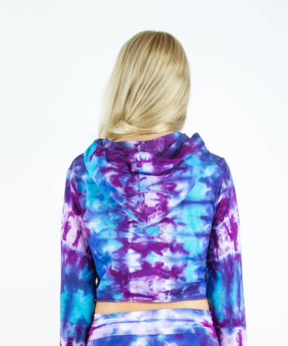 Woman wearing a purple and blue tie dye crop top hoodie by Akasha Sun.