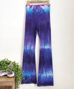 Purple and blue tie dye yoga pants with wide waistband.