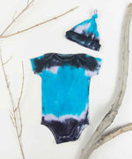 Blue and black tie dye organic cotton baby bodysuit and hat set.