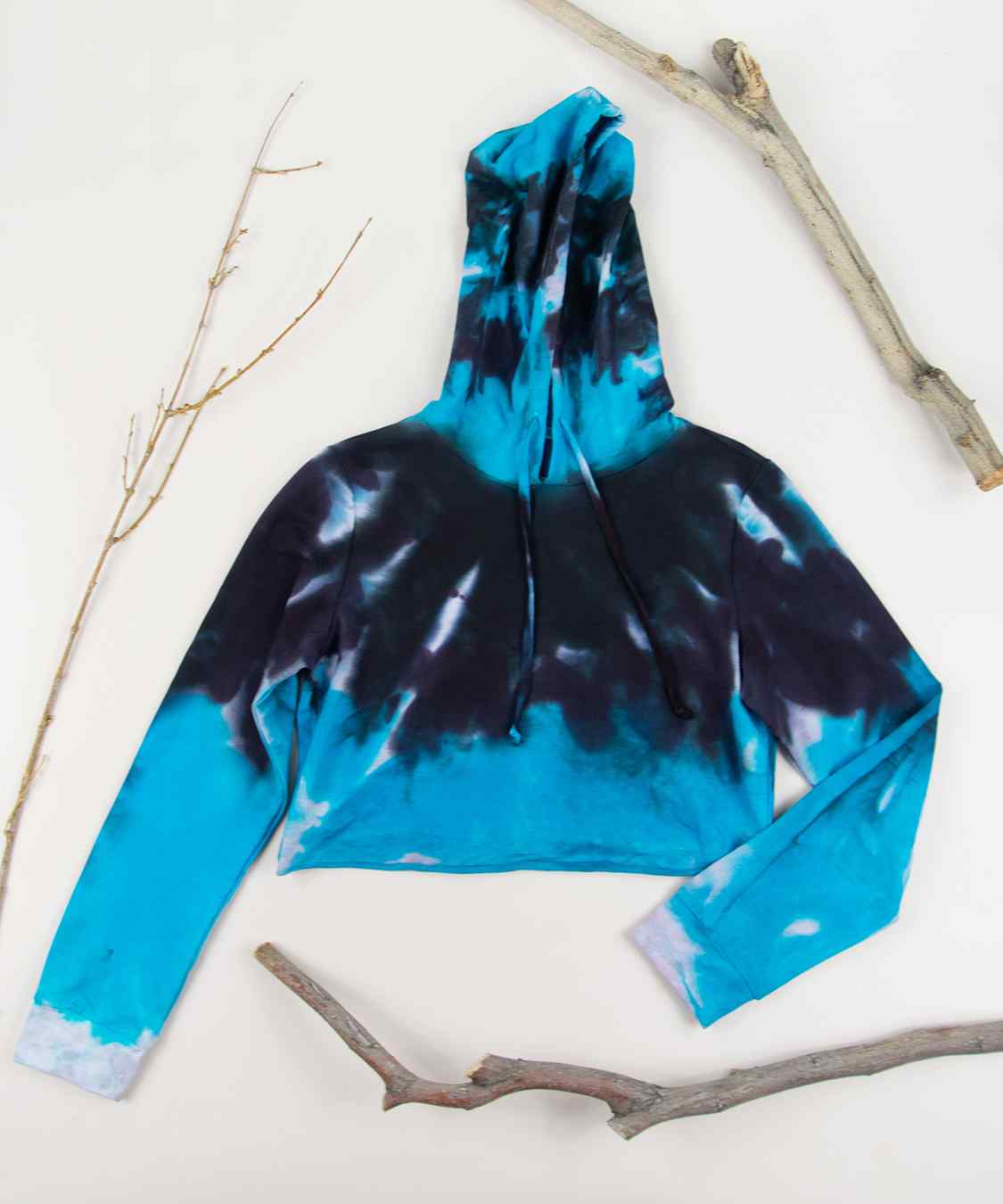 Blue and black tie dye hoodie crop top by Akasha Sun.