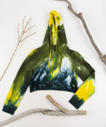 Yellow + black tie dye hoodie crop top with long sleeves and a hood by Akasha Sun.